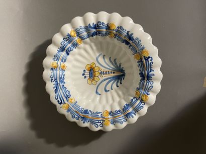 NEVERS 
Round earthenware dish with relief gadroons with blue and orange monochrome...