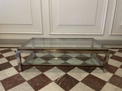 null Coffee table with two tops with chromed metal uprights.
1970's.
Signed Jean-Charles.
37x70x130...