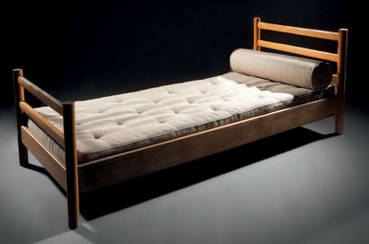 Charlotte PERRIAND (1903-1999) Varnished pine bed, c.1960, with hollowed out headboard...