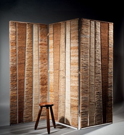 ADRIEN AUDOUX & FRIDA MINET Three-leaf screen in woven rattan of different sizes...