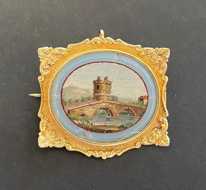 null 
Chased yellow gold brooch with a micro mosaic in its center



Bridge near...