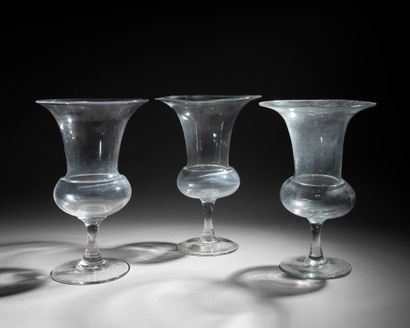 null Suite of three large blown glass vases; of flared form with swollen body, they...