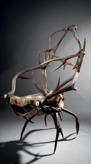 Curious seat made of antlers arranged in...