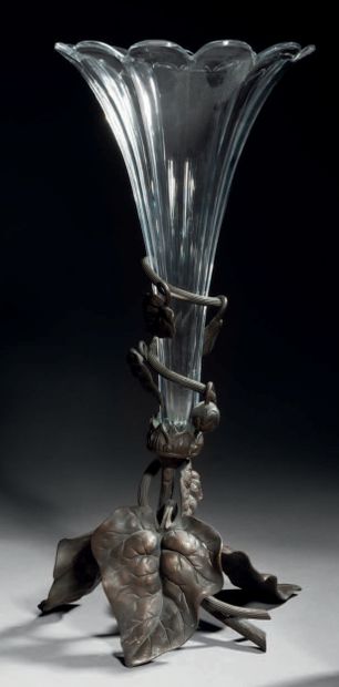 TRAVAIL FRANÇAIS White glass conical vase with grooves set in a wrought iron frame...