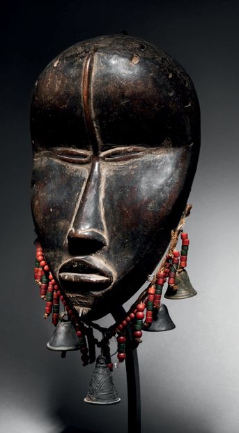 null Ɵ Singing mask with split eyes,
Dan, Ivory Coast
Hardwood, beads, metal, fiber
H....
