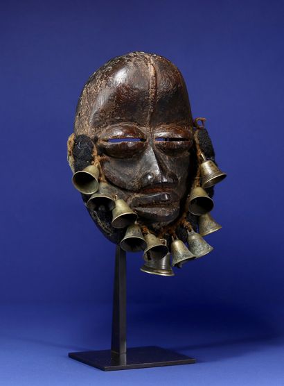  Beautiful singing mask adorned with a beard made of woven human hair and bronze...