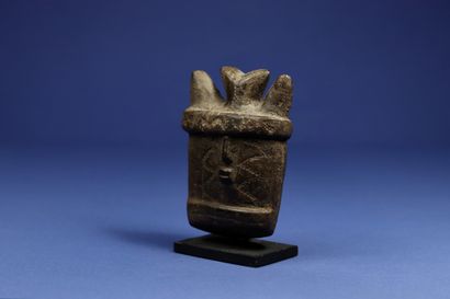 null 
Rare small mask showing a horned face with scarred cheeks, soapstone with brown...