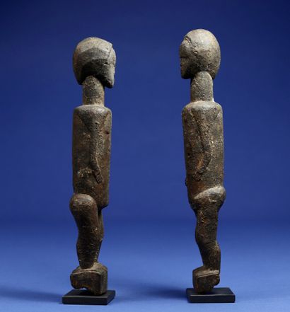  Charming couple of statuettes with simplified features. Wood with a crusty patina....