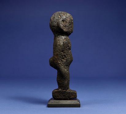null 
Divination statuette, the details of the sculpture disappearing under a thick...