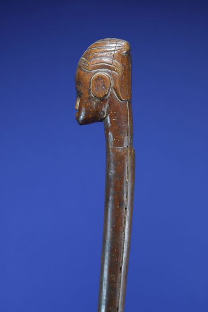 null 
Chief's cane with a human head at the top. 



Wood with a beautiful patina...