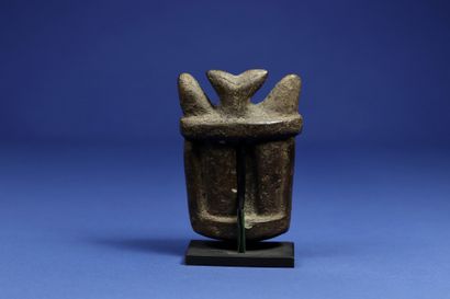 null 
Rare small mask showing a horned face with scarred cheeks, soapstone with brown...