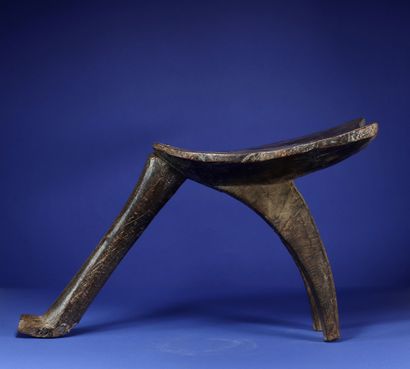  Tripod stool. Wood with a deep patina of...