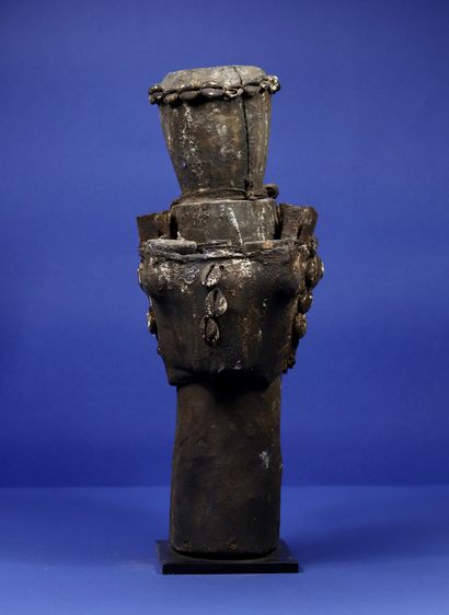 null 
Wooden votive figure representing a character summarily sculpted in a pole,...