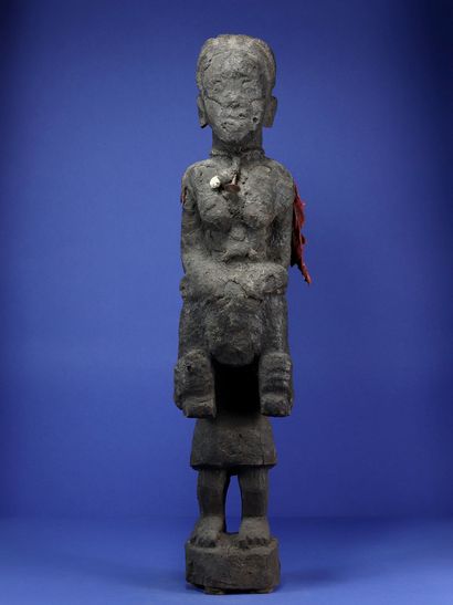 null 
Interesting wooden statue representing a standing figure carrying another on...