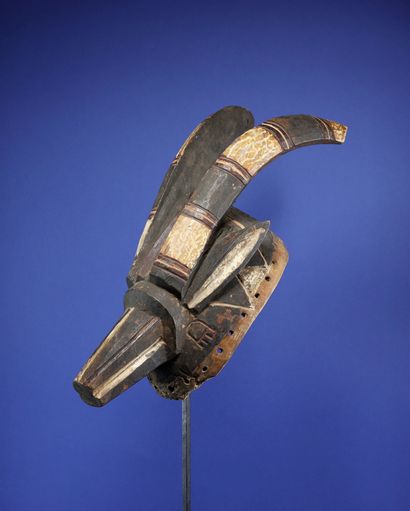  Beautiful antelope mask with taut lines showing two horns projected backwards, a...