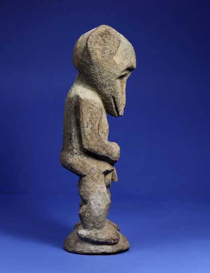 null 
Rare anthropo-zoomorphic male statue in a standing position, arms along the...