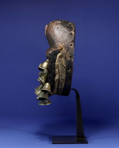 null 
Beautiful singing mask adorned with a beard made of woven human hair and bronze...