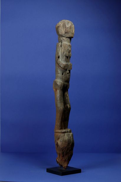 null 
Ancient botchio post in very eroded wood representing a female figure standing...