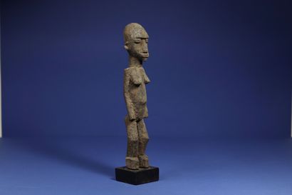 null 
Statuette representing a standing female figure. 



Wood with a crusty patina....