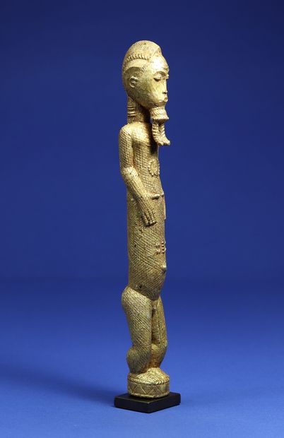  Elegant statuette representing a standing male figure, his short arms clasped to...