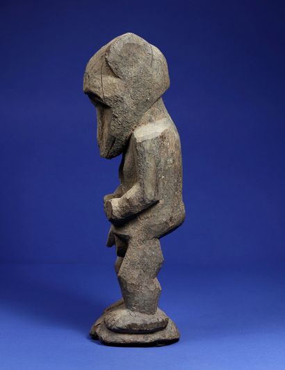 null 
Rare anthropo-zoomorphic male statue in a standing position, arms along the...