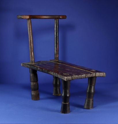  Low and narrow chair with beautiful patina of use. Wood and metal. Krou, Ivory Coast....