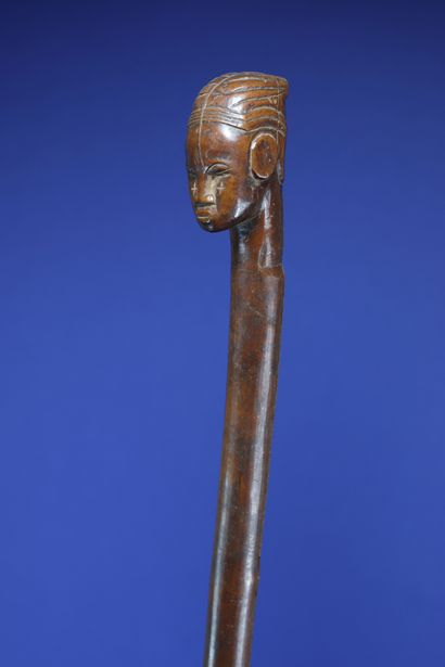 null 
Chief's cane with a human head at the top. 



Wood with a beautiful patina...