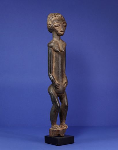  Beautiful long statue of a standing female figure, arms along the body, trunk extended,...