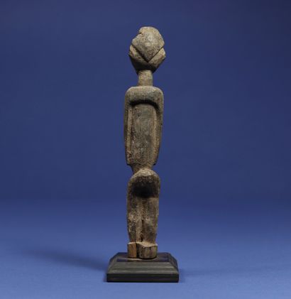  Statuette representing a standing figure. Wood with a crusty patina. Lobi, Burkina...