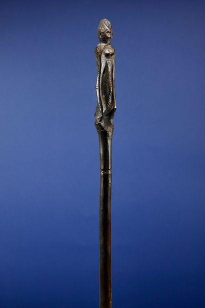  Poro cane carved at the top with a female...