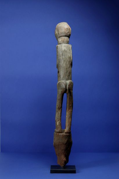 null 
Ancient botchio post in very eroded wood representing a female figure standing...