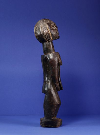 null 
Statue representing a standing female figure, the shoulders and chest projected...