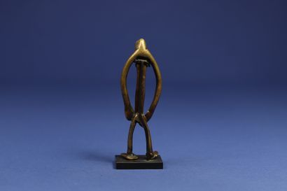 null 
Superb small bronze depicting a standing male figure, the filiform body perfectly...