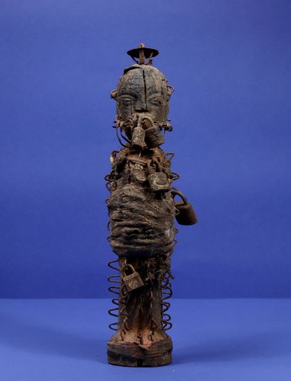 null 
Wooden votive statue representing a standing figure, the body covered with...