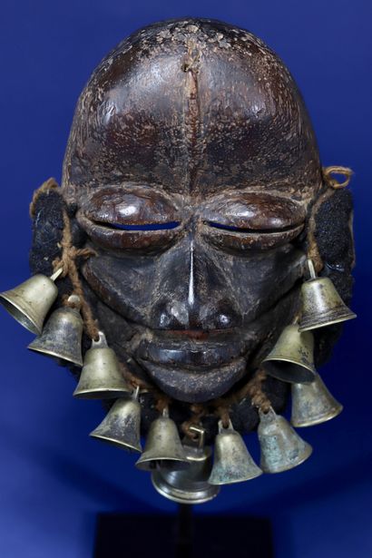 null 
Beautiful singing mask adorned with a beard made of woven human hair and bronze...