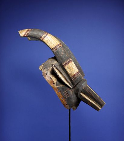 null 
Beautiful antelope mask with taut lines showing two horns projected backwards,...