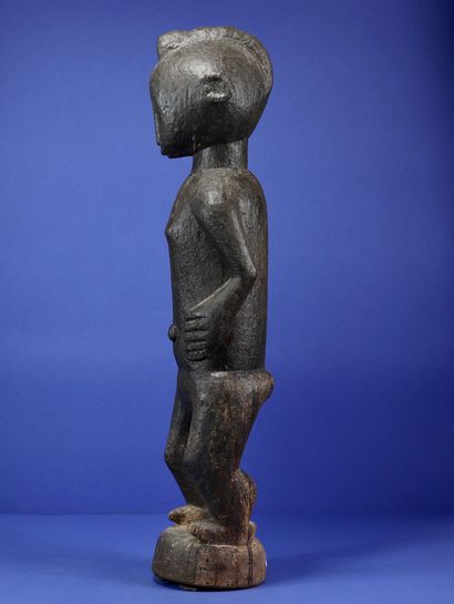 null 
Rare male divination statue from the M'bra representing a standing male figure,...