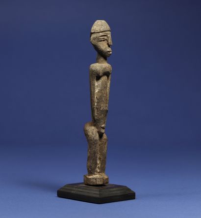  Statuette representing a standing figure. Wood with a crusty patina. Lobi, Burkina...