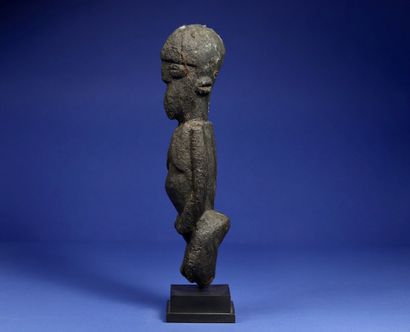 null 
Standing female statue, arms attached to the bust, ovoid head. 



Wood with...