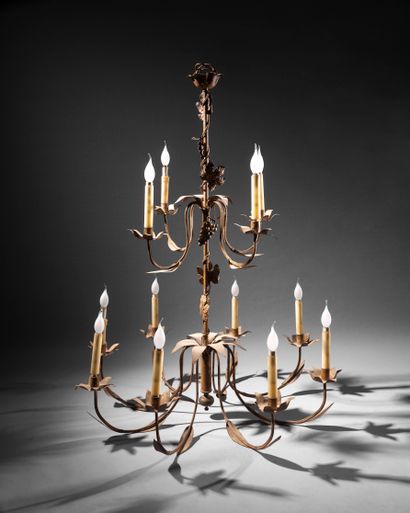 BAGUÈS (Dans le goût de) Twelve-light chandelier on two levels in gilded metal decorated...