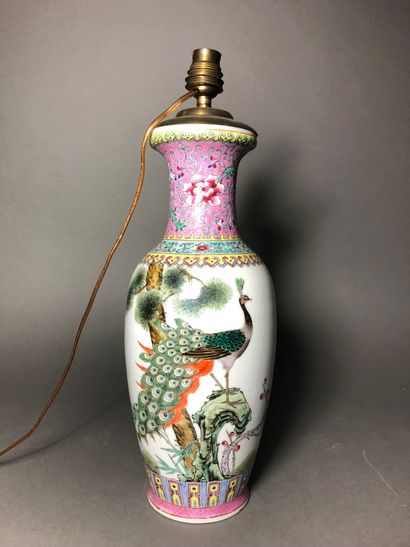 CHINE Baluster vase In polychrome porcelain in the taste of the pink family Decorated...