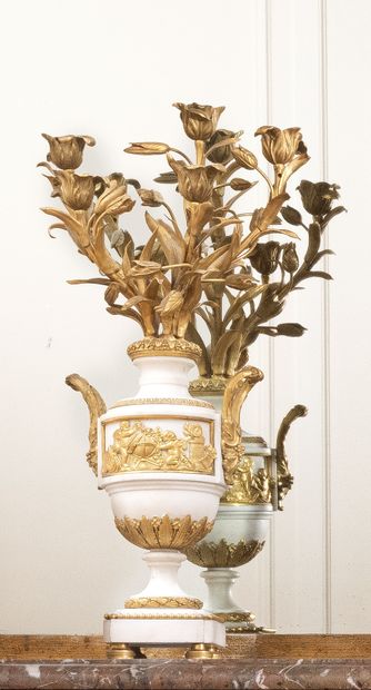 null Pair of candelabras with five arms of light in white marble and chased and gilded...