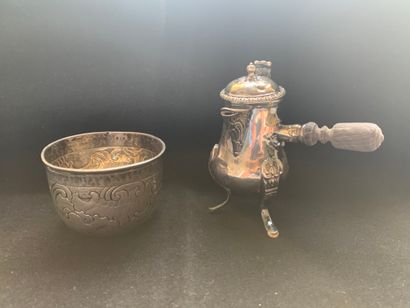  A silver goblet and self-serving jug, the goblet underlined by a frieze of rocaille...