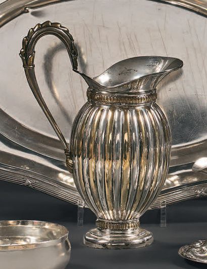  Silver ewer 925 thousandths posing on pedestal with decoration of gadroons alternating...