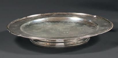 Round-shaped biscuit stand in silver 950 thousandths resting on a pedestal, the...