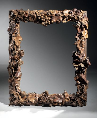 null Miroir à riche décor de pampres de vigne en cuir découpé
71 x 57 cm