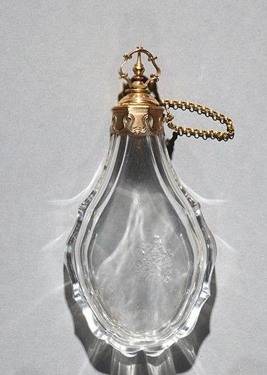 Large cut crystal piriform flask in a chased...