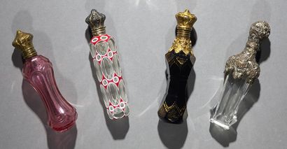 Set of four cut crystal perfume bottles,...