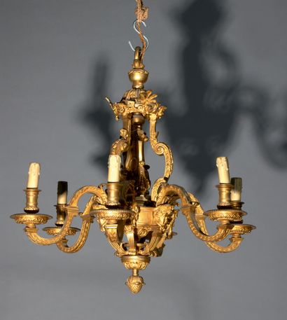 null Chased and gilded bronze chandelier with six arms of light.
The central shaft...