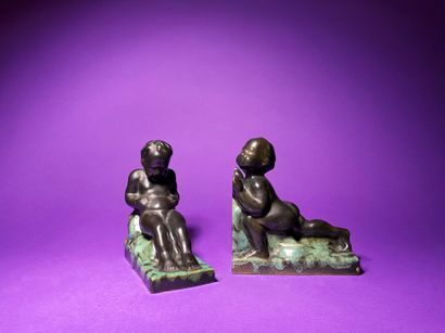 null French work circa 1950 Young putti at work Pair of ceramic bookends with shaded...